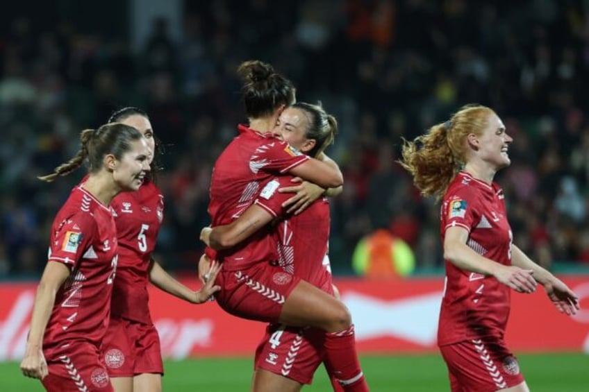 denmark stun china in 90th minute for winning world cup return