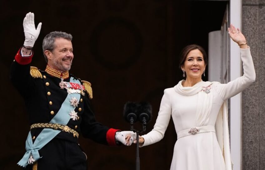 King Frederik X and Queen Mary wave from the balcony of Christiansborg Palace in Copenhagen