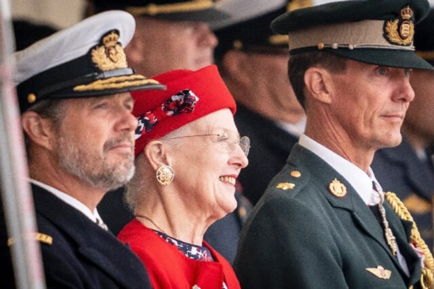 Queen Margrethe, seen flanked by her sons Crown Prince Frederik and Prince Joachim at an August parade, is now Europe's longest-serving monarch -- and only queen