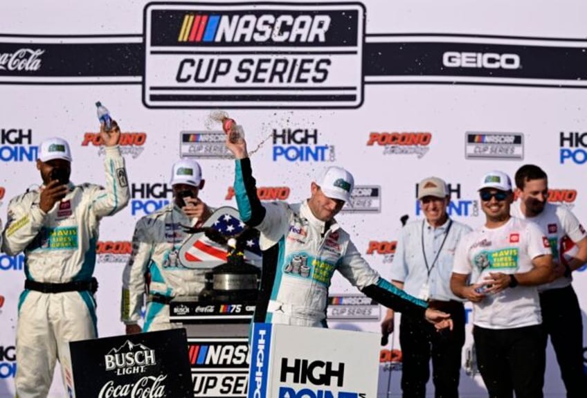 denny hamlin courts controversy counts victories at pocono after milestone 50th win in cup