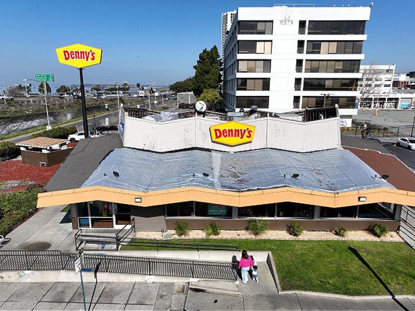 EMERYVILLE, CALIFORNIA - FEBRUARY 13: in an aerial view, customers enter a Denny's restaur