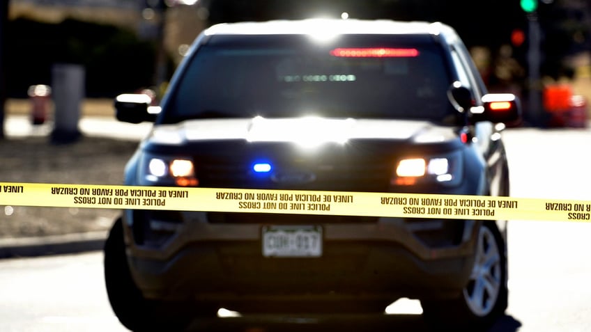 File photo of police vehicle, tape