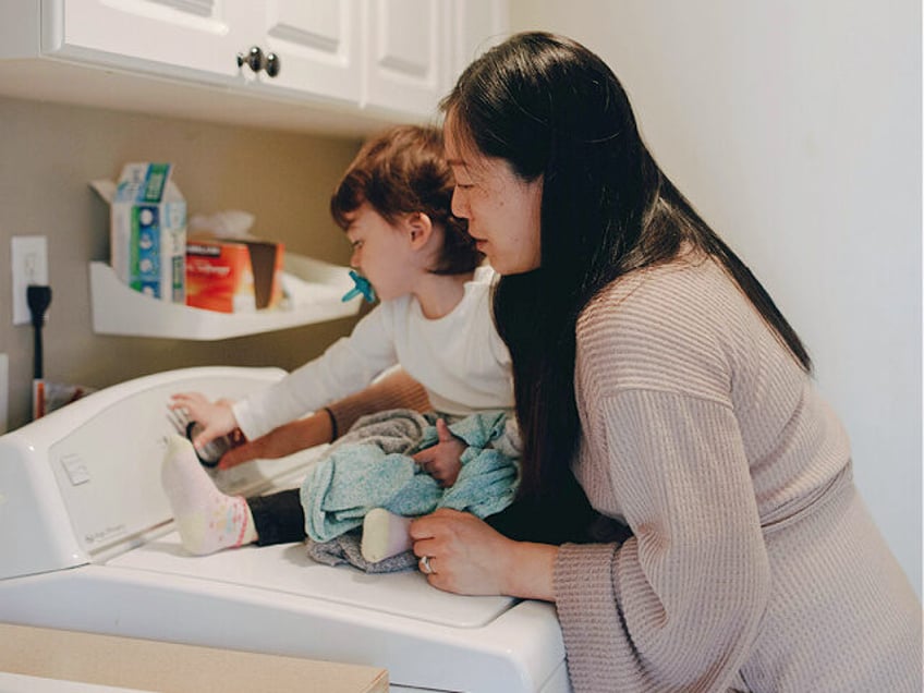 Mother And Child In The Laundry Room