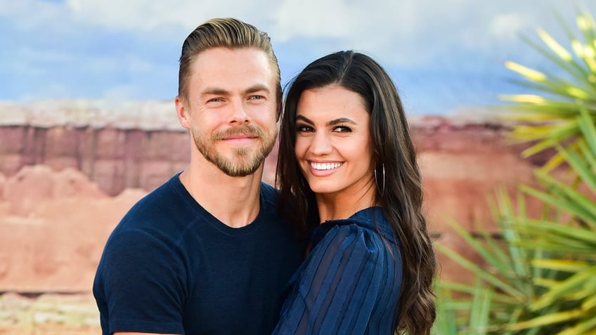 Derek Hough and Hayley Erbert cuddle at Netflix's "El Camino: A Breaking Bad Movie" premiere