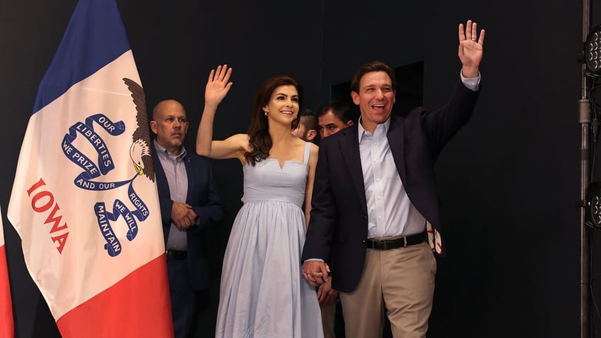 Ron and Casey DeSantis hold hands during campaign stop at Iowa church