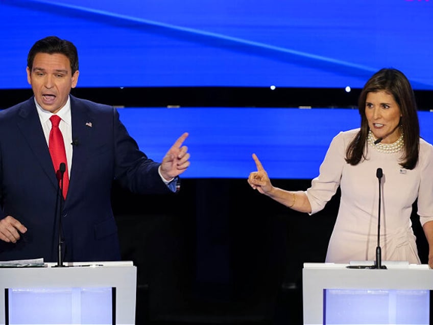 Former UN Ambassador Nikki Haley, right, and Florida Gov. Ron DeSantis, left, both speaking at the at the CNN Republican presidential debate at Drake University in Des Moines, Iowa, Wednesday, Jan. 10, 2024. (AP Photo/Andrew Harnik