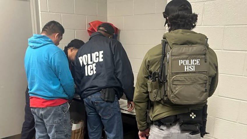 ICE officers make an arrest