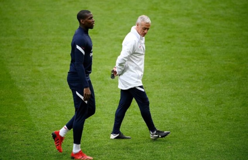 France international mdfielder Paul Pogba (L) and head coach Didier Deschamps (R)