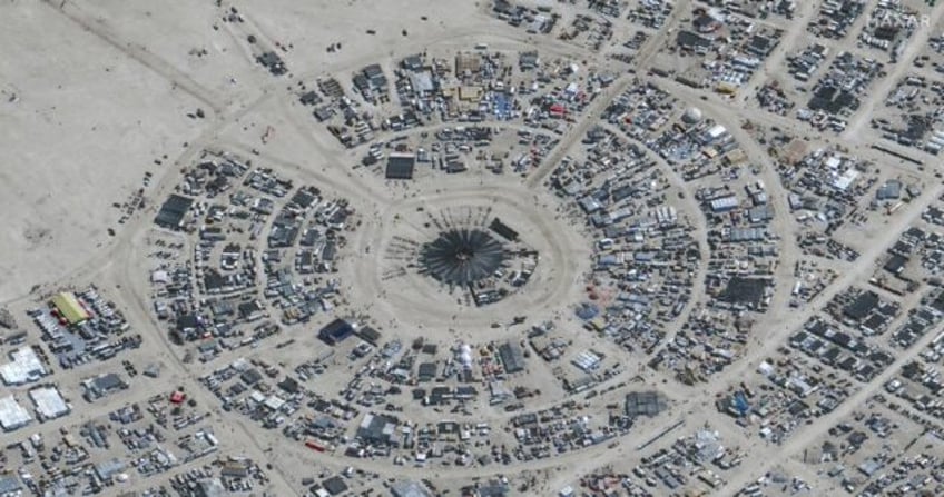 desert downpours dampen spirits of burning man festival in nevada