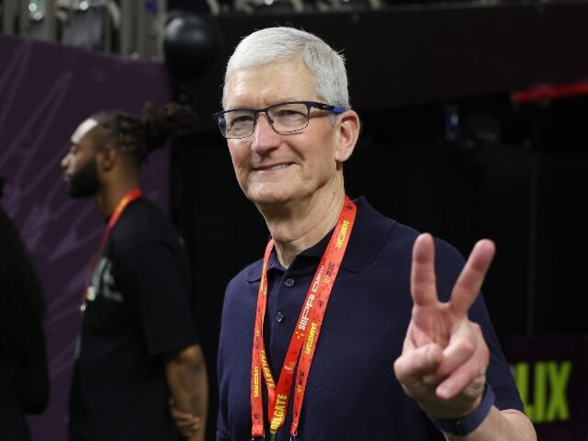 Apple chief Tim Cook looking happy