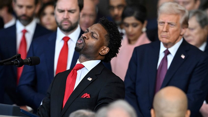 Pastor of 180 Church Lorenzo Sewell, delivers a benediction after President Donald Trump was sworn in