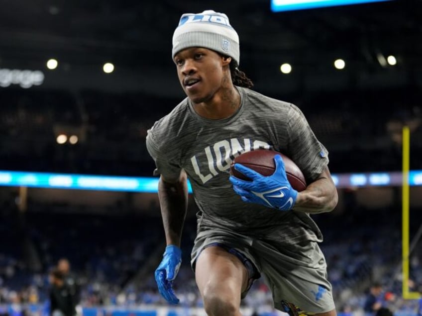 DETROIT, MICHIGAN - JANUARY 14: Jameson Williams #9 of the Detroit Lions warms-up prior to