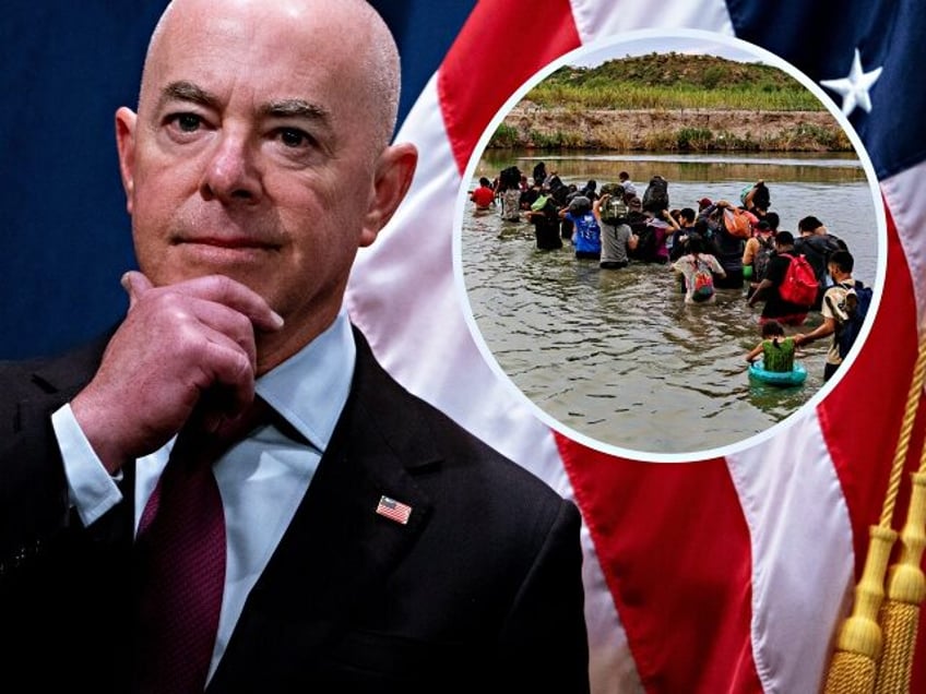 US Secretary of Homeland Security Alejandro Mayorkas looks on during a press conference to