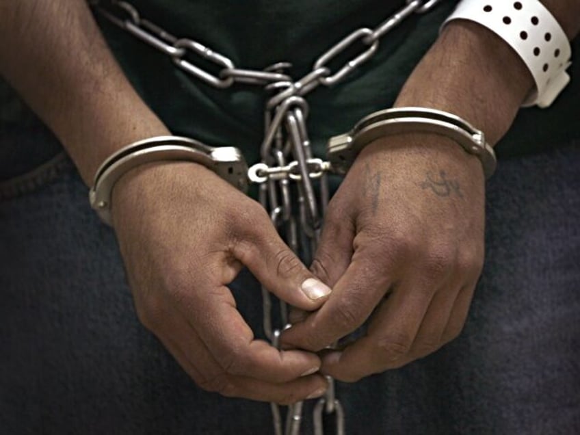 BROADVIEW, IL - MAY 25: An undocumented immigrant stands cuffed and shackled at the U.S. I