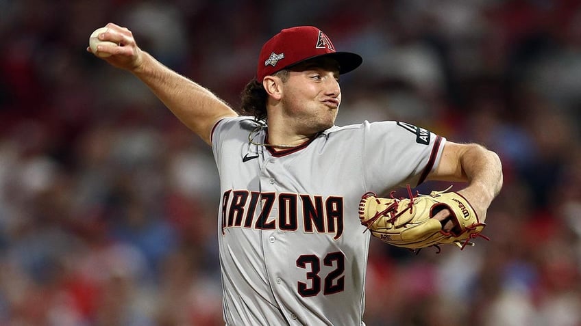 diamondbacks brandon pfaadt appears to read bible before taking mound in game 7 of nlcs