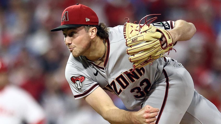 diamondbacks brandon pfaadt appears to read bible before taking mound in game 7 of nlcs