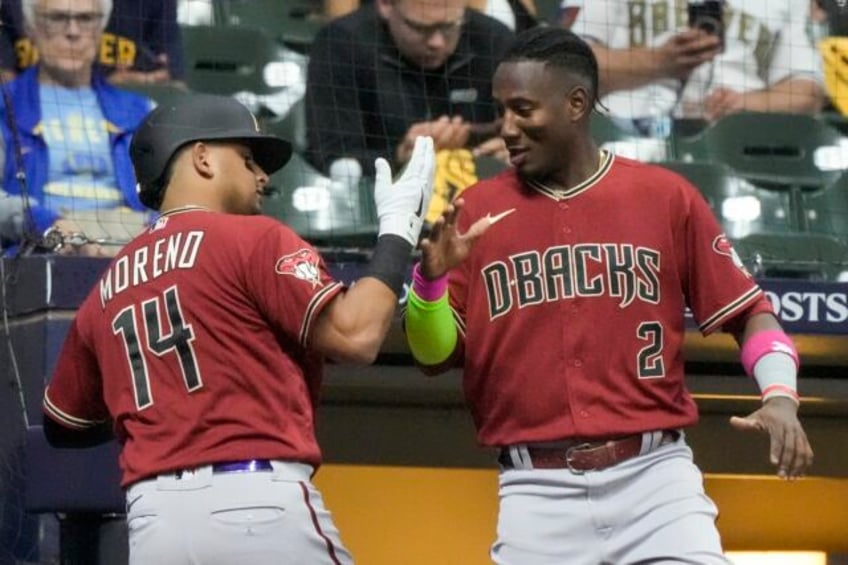 diamondbacks hit burnes hard to rally for 6 3 victory over brewers in wild card series opener