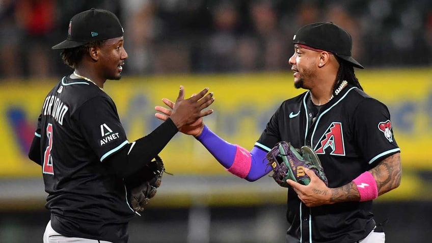 Geraldo Perdomo and Ketel Marte celebrate