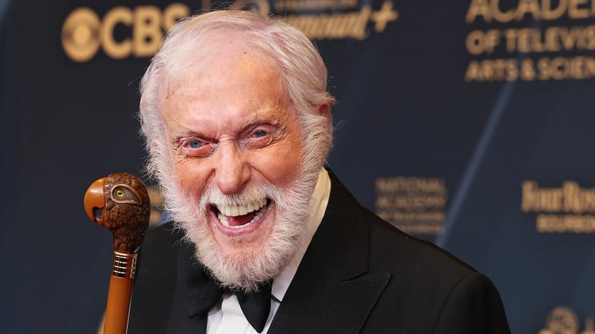 Dick Van Dyke in a tuxedo smiles on the carpet at the Daytime Emmy Awards