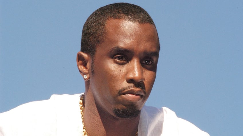 Sean Diddy Combs wears a white shirt.