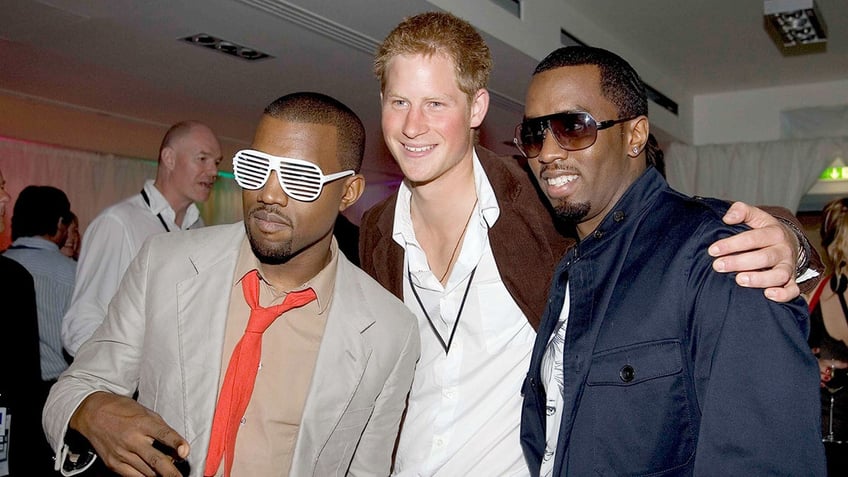 Prince Harry posing with Kanye West and Diddy