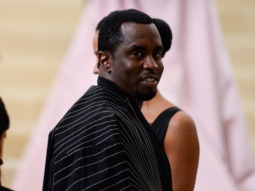 NEW YORK, NY - MAY 01: Rapper Sean Combs enters the Rei Kawakubo/Comme des Garcons: Art Of