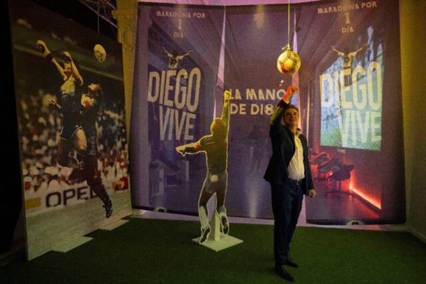 Visitors can have their photo taken at the exhibition recreating Maradona's notorious goal