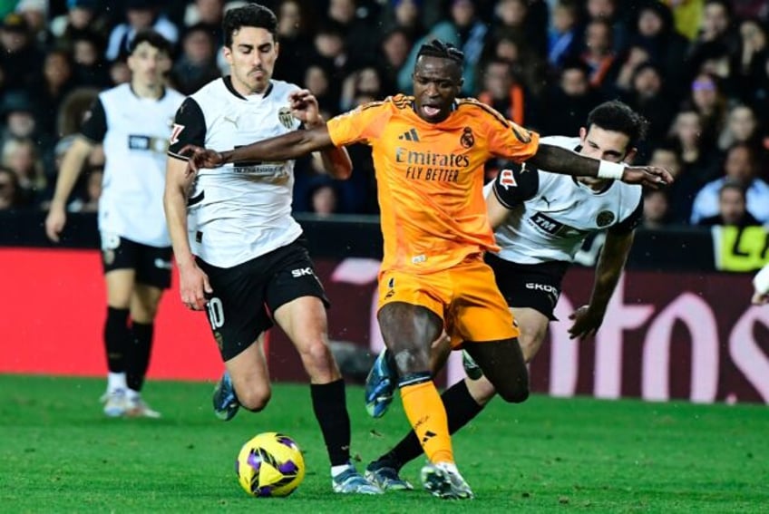 Real Madrid's Brazilian forward Vinicius Junior (C) was sent off in his team's win at Vale