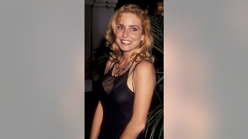 Dana Plato wearing a sheer black dress.