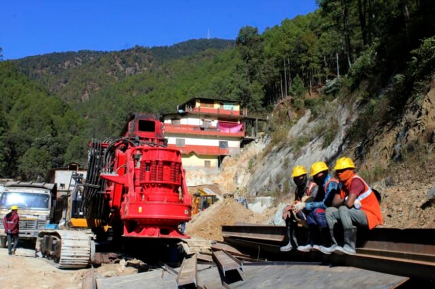 digging to rescue 41 workers trapped in a collapsed tunnel in india halted after machine breaks