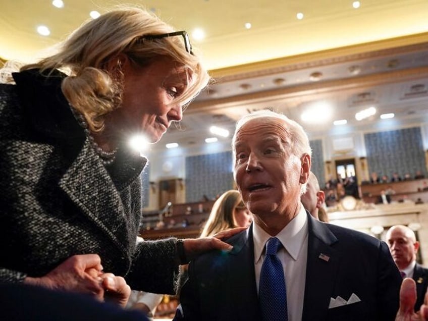 WASHINGTON, DC - FEBRUARY 07: U.S. President Joe Biden talks with Rep. Debbie Dingell (D-M