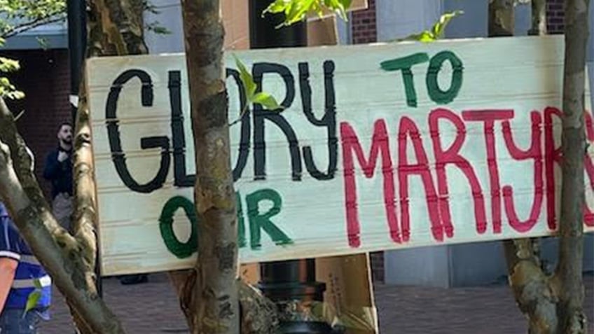 Glory to our martyrs sign at Rutgers