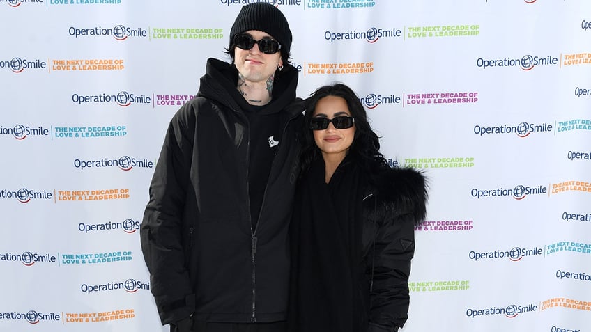 Demi Lovato and Jutes on the Operation Smile red carpet in black outfits.