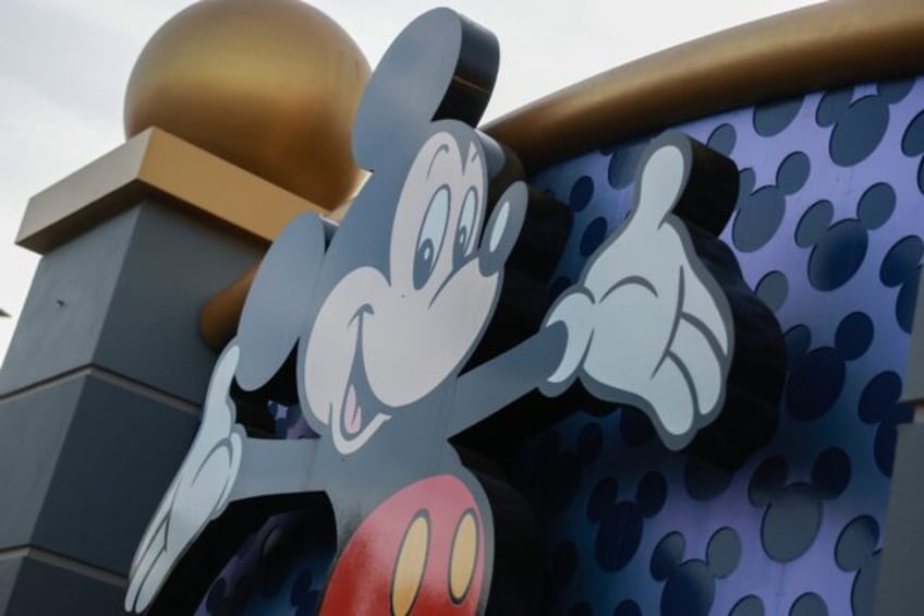 Mickey Mouse welcomes visitors near an entrance to Walt Disney World in Orlando, Florida