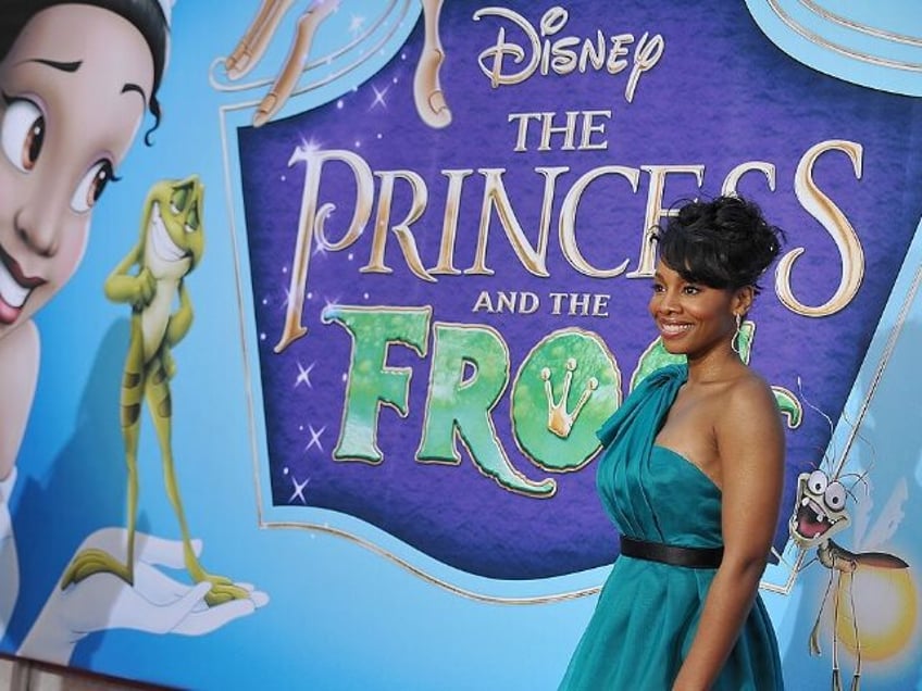 Actress Anika Noni Rose, the voice of Princess Tiana (at left on the poster), poses as she