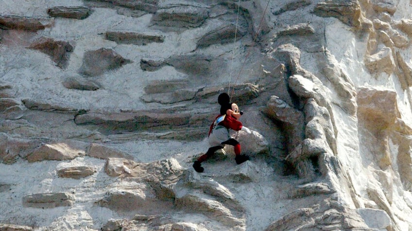 Mickey Mouse climbing the Matterhorn.