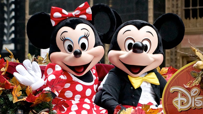 Minnie and Mickey Mouse ride Disney Parks float