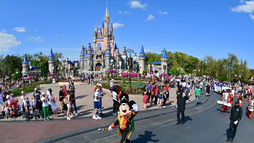 LAKE BUENA VISTA, FLORIDA - MARCH 03: Mickey Mouse waves to fans during a parade at Walt Disney World Resort on March 03, 2022 in Lake Buena Vista, Florida. (Photo by Julio Aguilar/Getty Images for Disney Dreamers Academy)