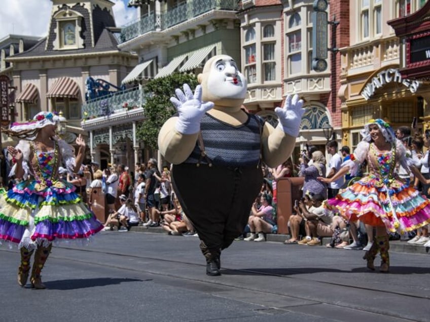 ORANGE COUNTY, FLORIDA, USA - JUNE 1: Dancers perform during a parade at the Magic Kingdom