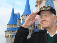 Disney's Magic Kingdom honors 100-year-old WWII veteran during flag retreat ceremony