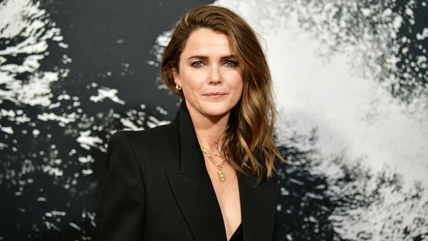 Keri Russell in a black low cut blazer on the carpet