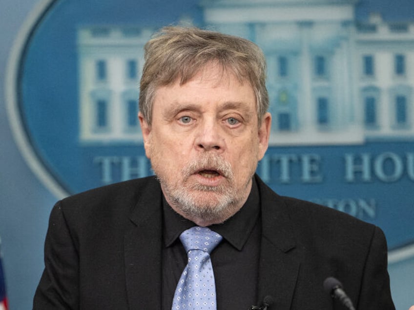 (L-R) White House Press Secretary Karine Jean-Pierre looks on as US actor Mark Hamill spea