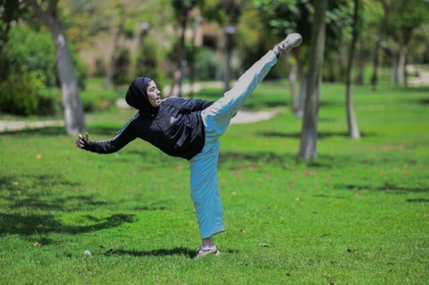 Mais Elbostami trains in a Cairo park