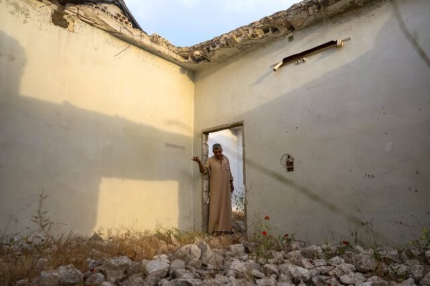 Aref Shamtan, 73: 'I feel good here, even among the rubble'