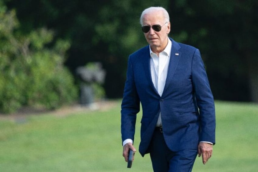 US President Joe Biden walks to the White House in Washington, DC, on July 7, 2024, after