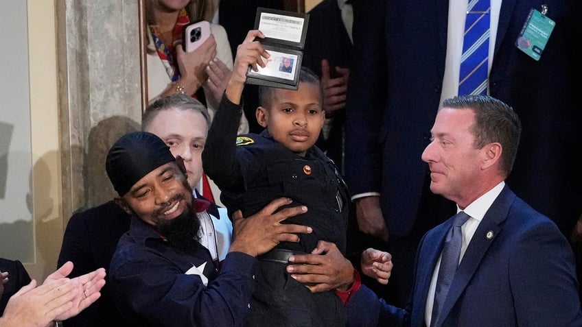 Cancer survivor DJ Daniel during Trump's speech