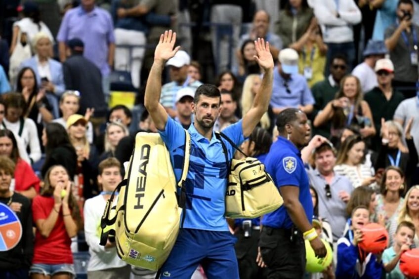 All over: Novak Djokovic waves at the crowd after his defeat against Australia's Alexei Po