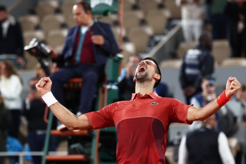 Epic win: Novak Djokovic celebrates after winning against Lorenzo Musetti