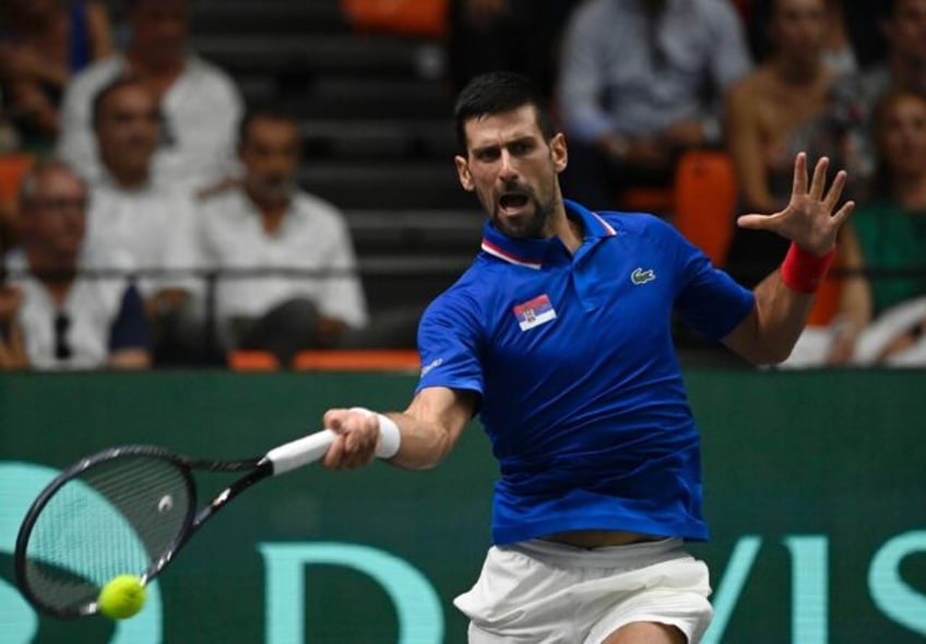 djokovic powers serbia into davis cup quarters britain win again