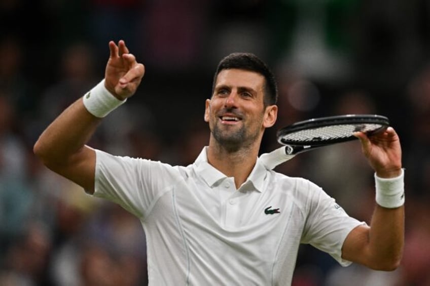 Novak Djokovic pretends to play the violin after beating Alexei Popyrin at Wimbledon